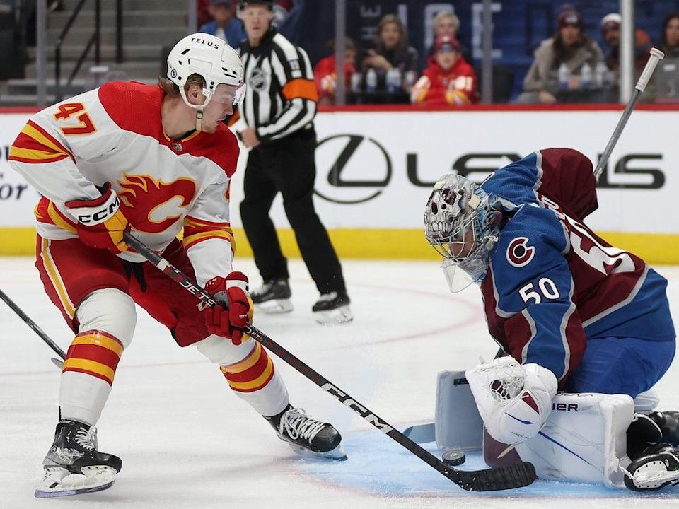  Goalie Ivan Prosvetov #50 of the Colorado Avalanche saves a shot on goal by Connor Zary #47 of the Calgary Flames in the first period at Ball Arena on November 25, 2023 in Denver, Colorado. (Photo by Matthew Stockman/Getty Images)