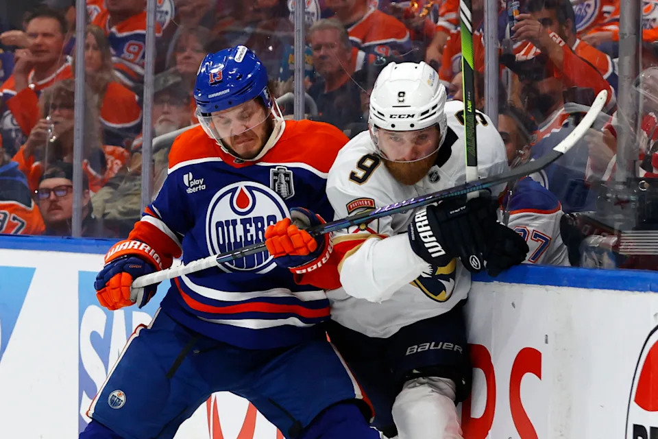 Oilers center Mattias Janmark (13) checks Panthers center Sam Bennett (9) in the 2025 Stanley Cup Final at Rogers Place.Perry Nelson-Imagn Images