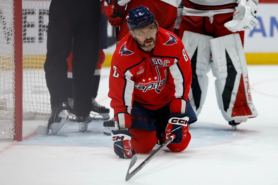 Washington Capitals left wing Alex Ovechkin (8) kneels on the ice after a stoppage in play against the Carolina Hurricanes at Capital One Arena.Geoff Burke-Imagn Images