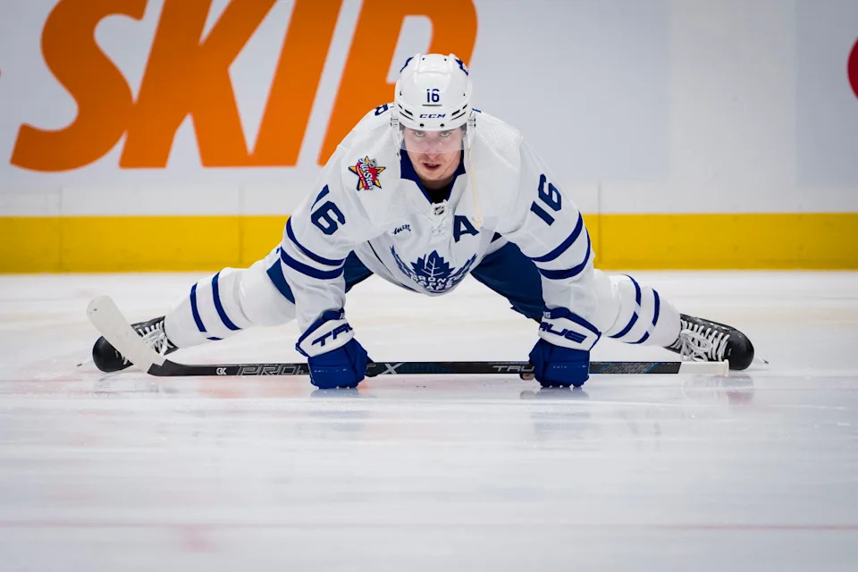 Toronto Maple Leafs forward Mitchell Marner (16) stretches during warm up before a game against the Vancouver Canucks at Rogers Arena.Bob Frid-Imagn Images