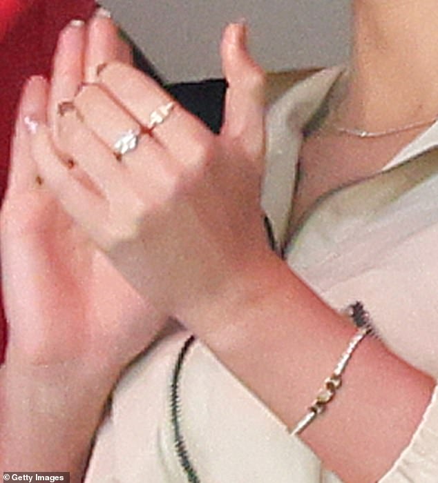 Kelce surprised Swift with the tennis bracelet, as well as a matching version for himself, in early 2024. Meanwhile, Swift debuted the double 'T' ring, which is from Tiffany & Co., in June 2024 during her Eras Tour