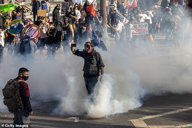 LOS ANGELES: Police launch tear gas and shoot less-than-lethal munitions at protestors Saturday