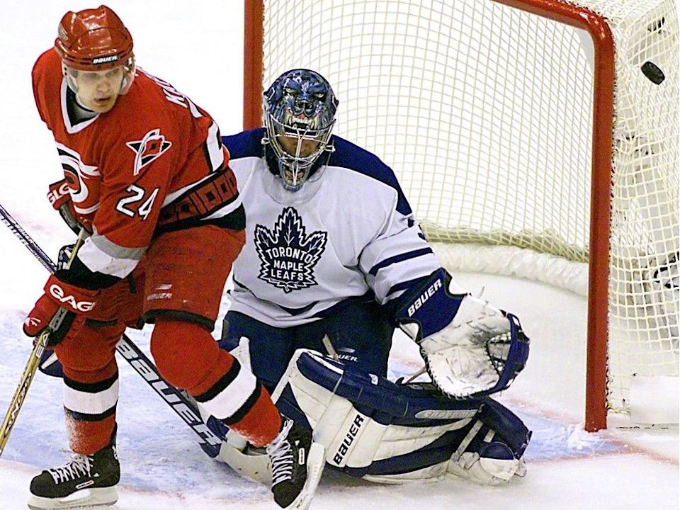  Toronto Maple Leafs goalie Curtis Joseph makes a save in front of Carolina Hurricanes’ Sami Kapanen late in the first period of Game 3 of the 2002 Eastern Conference Final.