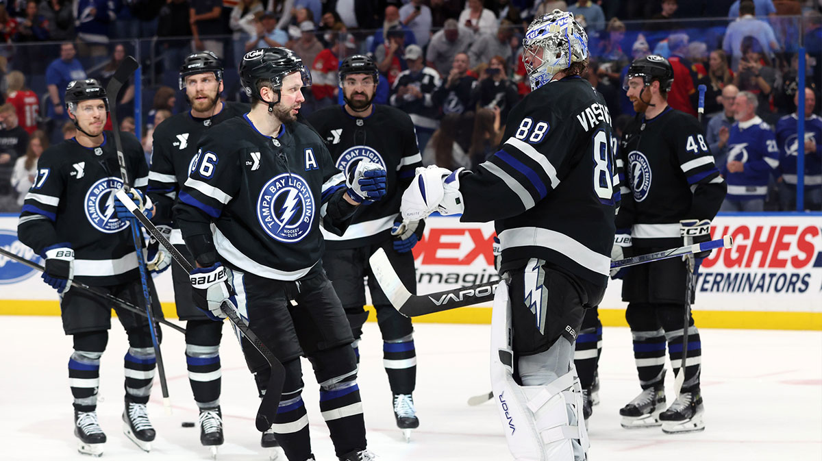 Tampa Bay Lightning goaltender Andrei Vasilevskiy (88) and Tampa Bay Lightning right wing Nikita Kucherov (86) celebrate after they beat the Florida Panthers at Amalie Arena.