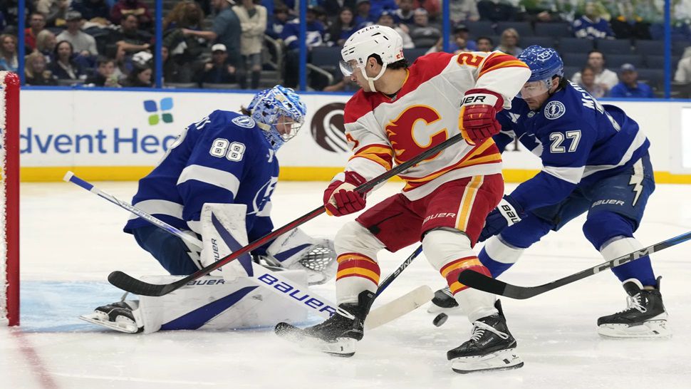 Tampa Bay goaltender Andrei Vasilevskiy and defenseman Ryan McDonagh team up to stop a shot in the first period against Calgary on Thursday night.
