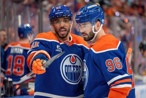 Evander Kane #91 and Jake Walman #96 of the Edmonton Oilers discuss the play in the first period of Game Three of the Second Round of the 2025 Stanley Cup Playoffs against the Vegas Golden Knights at Rogers Place on May 10, 2025, in Edmonton, Alberta, Canada. (Photo by Leila Devlin/Getty Images)