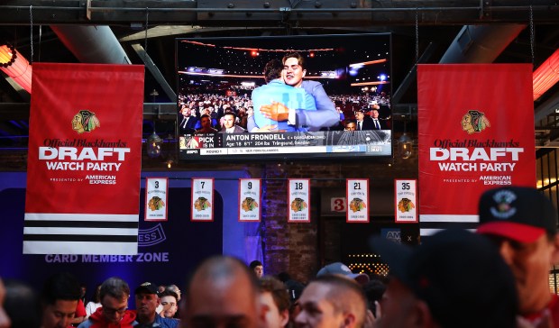 An image of Anton Frondell receiving a hug after being...