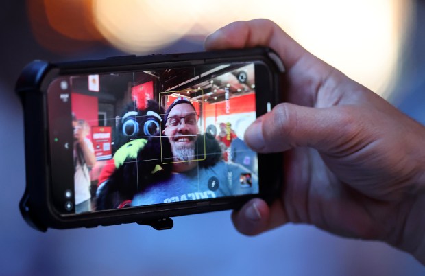 Rich Marcinkiewicz takes a selfie with Chicago Blackhawks mascot Tommy...