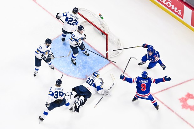 James Hagens celebrates his goal with Team USA teammate Ryan Leonard (9) in the first period of the gold-medal game against Finland during the IIHF World Junior Championship on Jan. 5, 2025, in Ottawa. (Minas Panagiotakis/Getty Images)