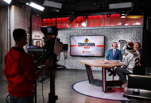 The Blackhawks Countdown Live in-studio team of Pat Boyle and Tony Granato talk with guest CM Punk before the home opener at the United Center on Oct. 17, 2024. (Chris Sweda/Chicago Tribune)