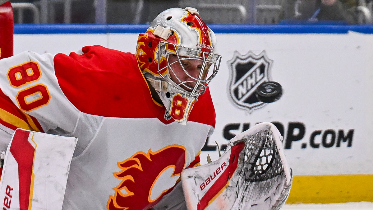 Calgary Flames goaltender Dan Vladar (80) makes a save against the New York Islanders during the second period at UBS Arena.
