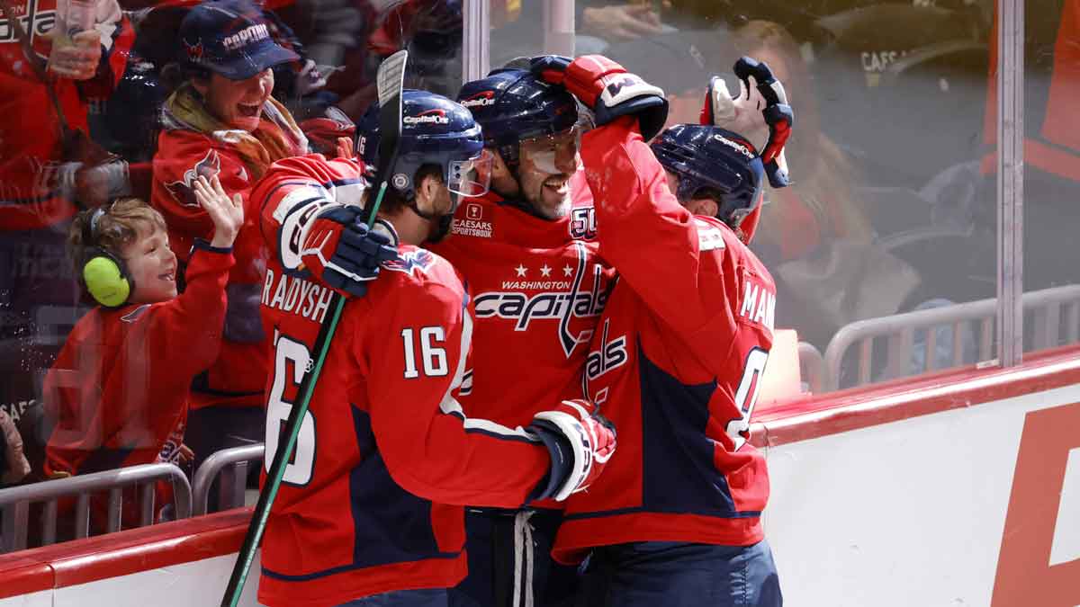 Washington Capitals left wing Alex Ovechkin (8) celebrates with Capitals left wing Andrew Mangiapane (88) after an assist on goal against the Florida Panthers during the second period at Capital One Arena.