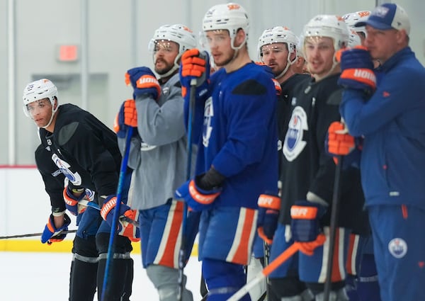 Edmonton Oilers defenceman Darnell Nurse, left, looks up ice during practice at the NHL Stanley Cup Finals in Fort Lauderdale, Fla., Tuesday, June 10, 2025.(Nathan Denette/The Canadian Press via AP)