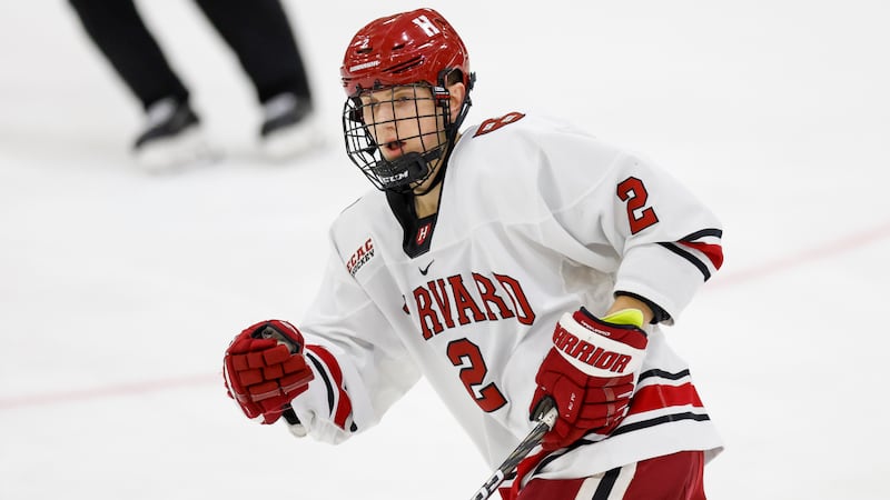 Harvard University defenseman Ian Moore skates during game against Clarkson University on Friday, Jan. 13, 2023, in Cambridge, Mass. Moore was born in Utah but his family moved to Massachusetts when he was young.