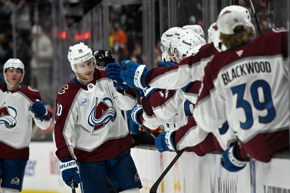 Colorado Avalanche center Charlie Coyle (10) celebrates with teammates after scoring against...