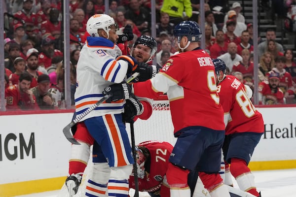 Edmonton Oilers and Florida Panthers players trade punches during the first period of Game 6 of the NHL hockey Stanley Cup Final Tuesday, June 17, 2025, in Sunrise, Fla. (AP Photo/Lynne Sladky)