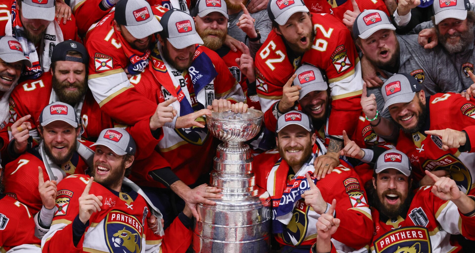 The Florida Panthers pose with the cup for a team photo after winning game seven of the 2024 Stanley Cup Final against the Edmonton Oilers at Amerant Bank Arena.