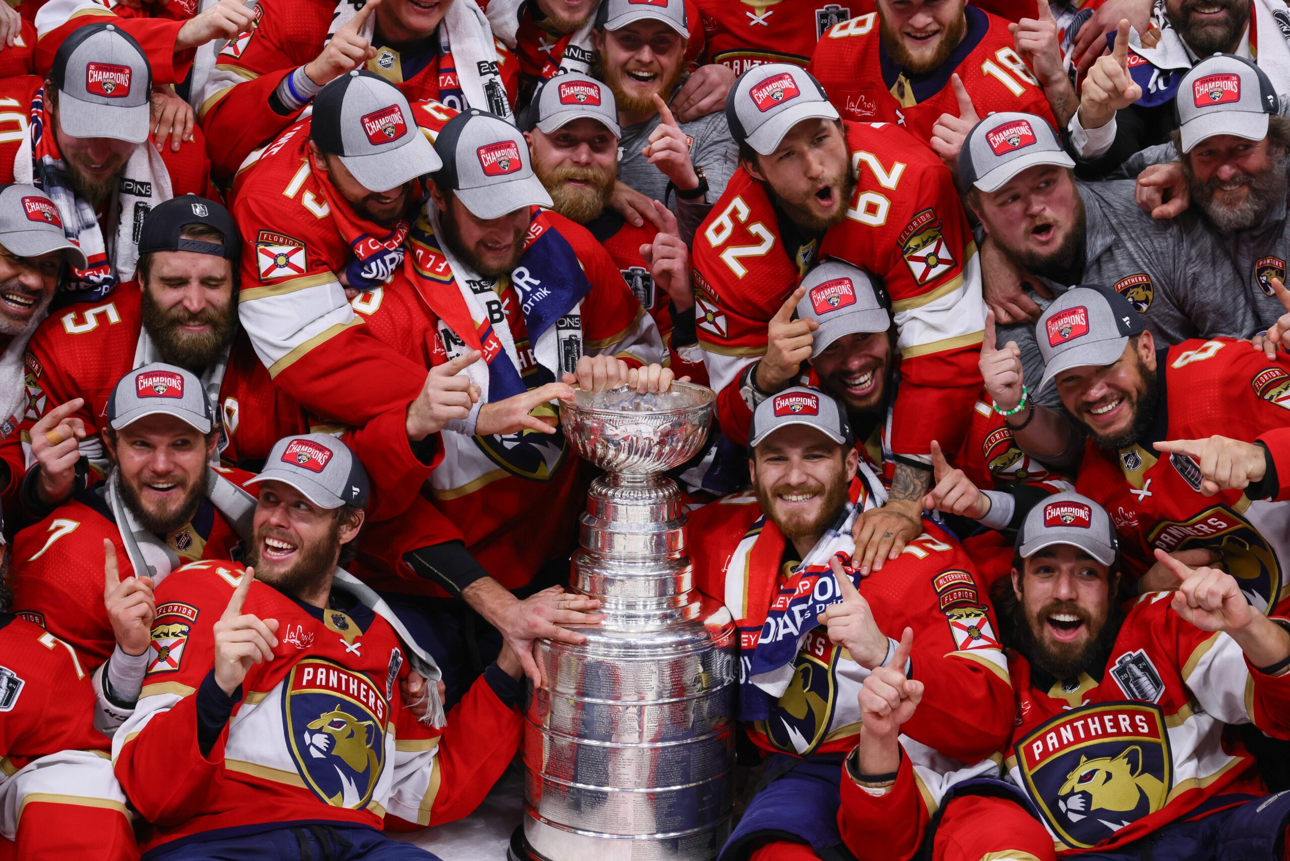 The Florida Panthers pose with the cup for a team photo after winning game seven of the 2024 Stanley Cup Final against the Edmonton Oilers at Amerant Bank Arena.