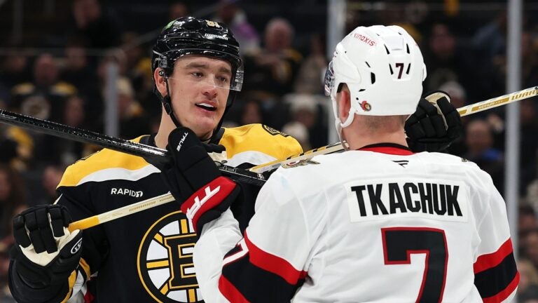 BOSTON, MASSACHUSETTS - JANUARY 23: Nikita Zadorov #91 of the Boston Bruins and Brady Tkachuk #7 of the Ottawa Senators fight during the second period at TD Garden on January 23, 2025 in Boston, Massachusetts.