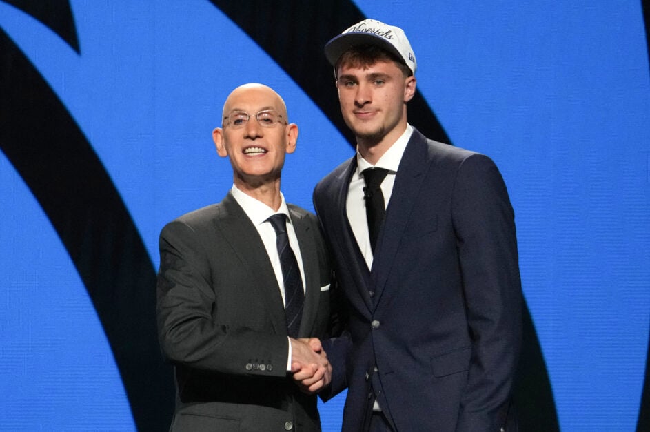 Cooper Flagg (R) shakes hands with NBA Commissioner Adam Silver after being selected first overall by the Dallas Mavericks in the 2025 NBA Draft.