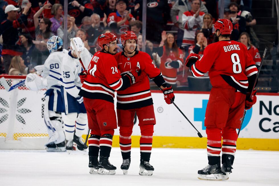 Carolina Hurricanes' Sebastian Aho, center, celebrates his goal against the Toronto Maple...