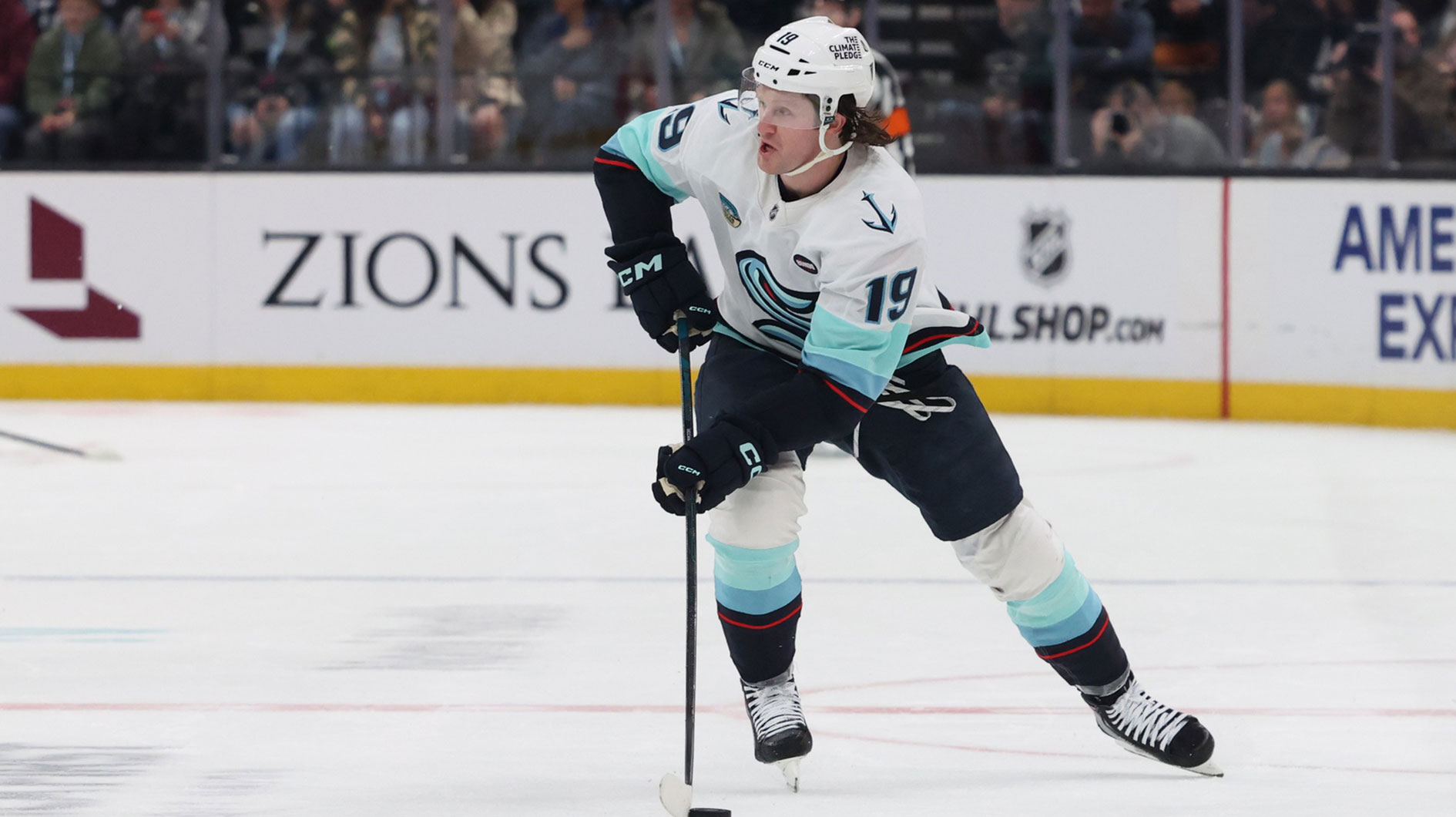 Seattle Kraken left wing Jared McCann (19) skates with the puck against Utah Hockey Club during the first period at Delta Center. 