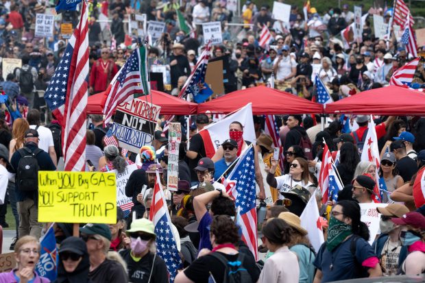 Thousands of No Kings protesters marched against the policies of...