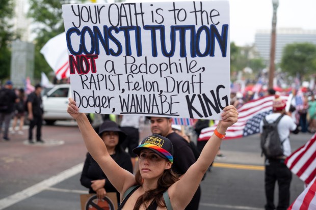 Thousands of No Kings protesters marched against the policies of...