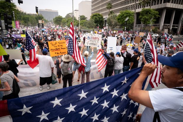 Thousands of No Kings protesters marched against the policies of...