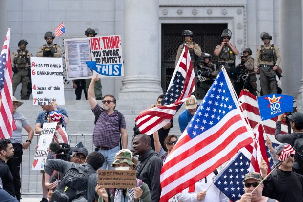 Thousands of No Kings protesters marched against the policies of...
