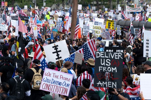 Thousands of No Kings protesters marched against the policies of...