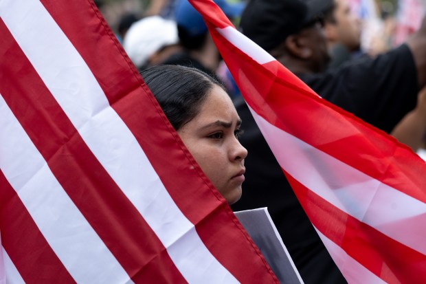 Thousands of No Kings protesters marched against the policies of...