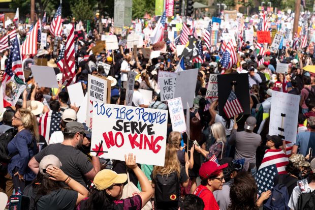 Thousands of No Kings protesters marched against the policies of...