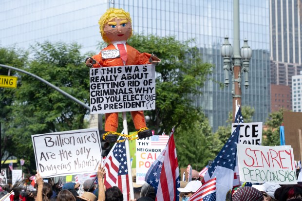 Thousands of No Kings protesters marched against the policies of...