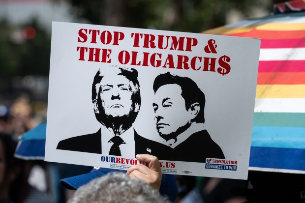 Thousands of No Kings protesters marched against the policies of...