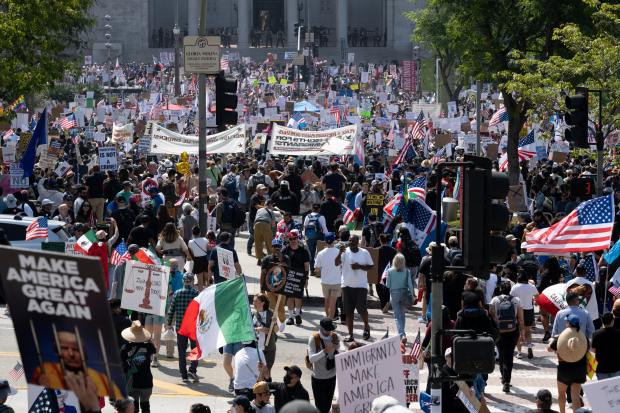 Thousands of No Kings protesters marched against the policies of...