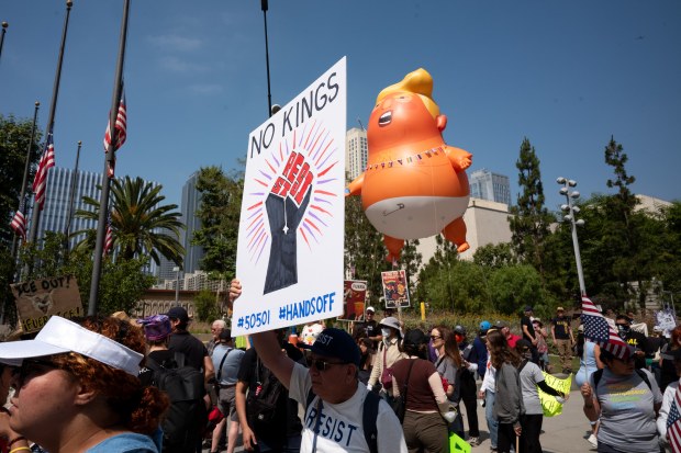 Thousands of No Kings protesters marched against the policies of...