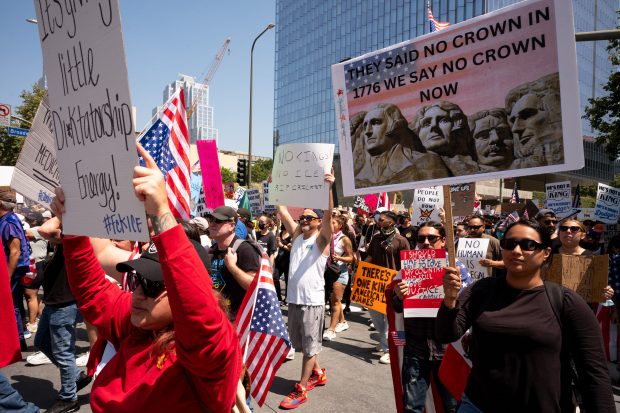 Thousands of No Kings protesters marched against the policies of...