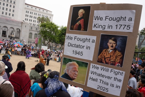 Thousands of No Kings protesters marched against the policies of...