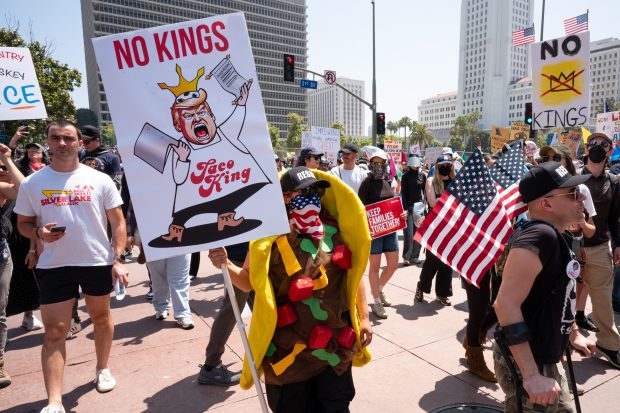 Thousands of No Kings protesters marched against the policies of...