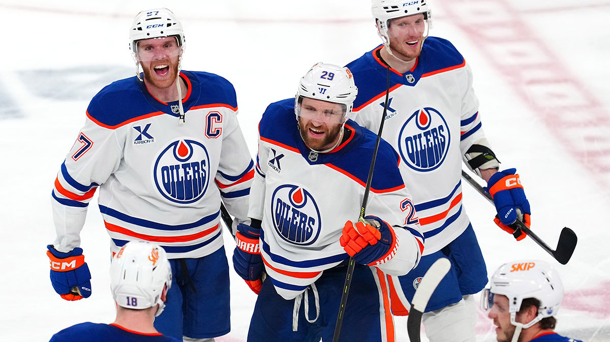 Edmonton Oilers center Connor McDavid (97) celebrates with center Leon Draisaitl (29) and goaltender Olivier Rodrigue (35) after the Oilers defeated the Vegas Golden Knights 1-0 during an overtime victory, completing a 4-1 series win during game five of the second round of the 2025 Stanley Cup Playoffs at T-Mobile Arena.