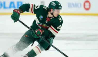 Marco Rossi of the Minnesota Wild skating in a green Wild uniform