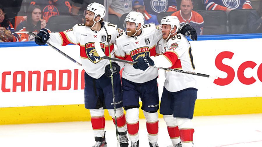 Matthew Tkachuk #19, Sam Bennett #9 and Nate Schmidt #88 of the Florida Panthers...