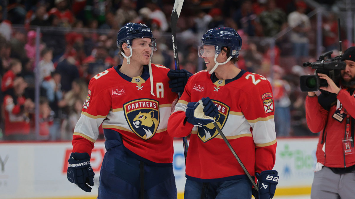 Florida Panthers left wing Matthew Tkachuk (19) and center Carter Verhaeghe (23) celebrate after the game against the Ottawa Senators at Amerant Bank Arena.