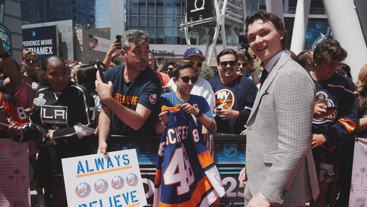 Matthew Schaefer walks the red carpet during the NHL hockey draft Friday, June 27, 2025, in Los Angeles. (AP Photo/Damian Dovarganes)
