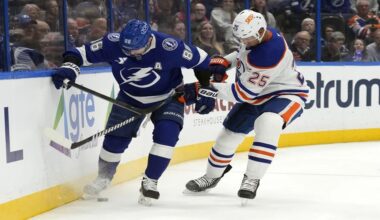 Tampa Bay right wing Nikita Kucherov and Edmonton Oilers defenseman Darnell Nurse (25) battle for the puck during the second period on Tuesday night.