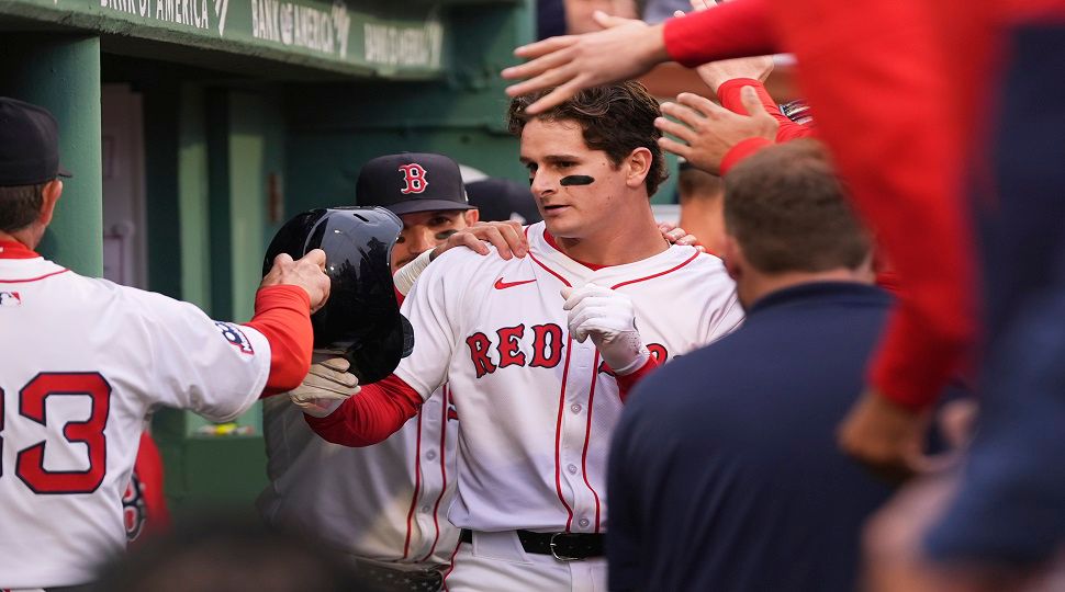 Boston Red Sox rookie Roman Anthony is congratulated after his two RBI double, his first major league hit, after the first inning of a baseball game against the Tampa Bay Rays at Fenway Park, Tuesday, June 10, 2025, in Boston. (AP Photo/Charles Krupa)