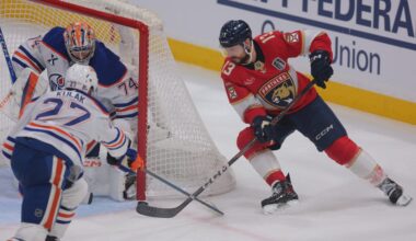 Florida Panthers forward Sam Reinhart (13) attempts a wrap around against Edmonton Oilers goaltender Stuart Skinner (74) and defenseman Brett Kulak (27) during the second period in game three of the 2025 Stanley Cup Final at Amerant Bank Arena.