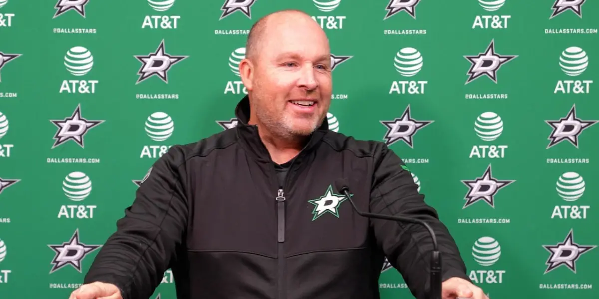 Steve Spott at the podium after a Dallas Stars practice