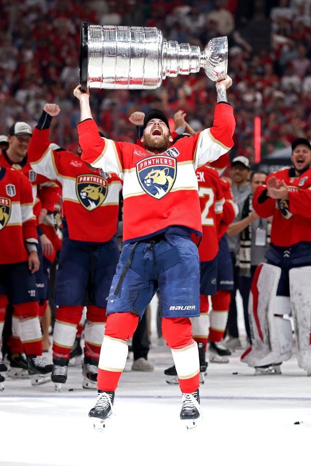 A.J. Greer #10 of the Florida Panthers celebrates with the Stanley Cup after defeating the Edmonton Oilers in Game Six of the 2025 Stanley Cup Final at Amerant Bank Arena on June 17, 2025 in Sunrise, Florida. (Photo by Christian Petersen/Getty Images)